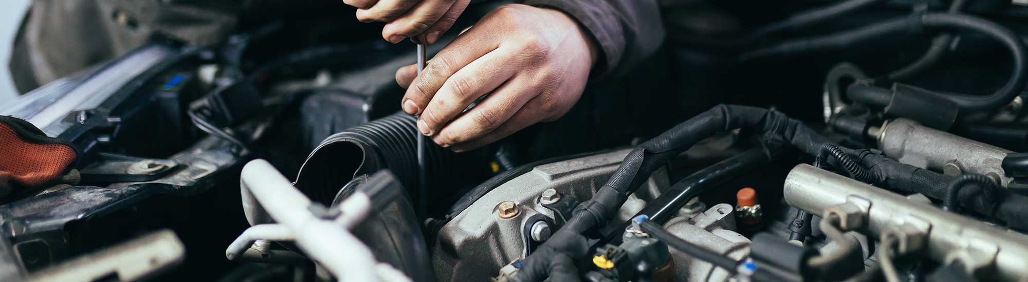 Person Working on Car